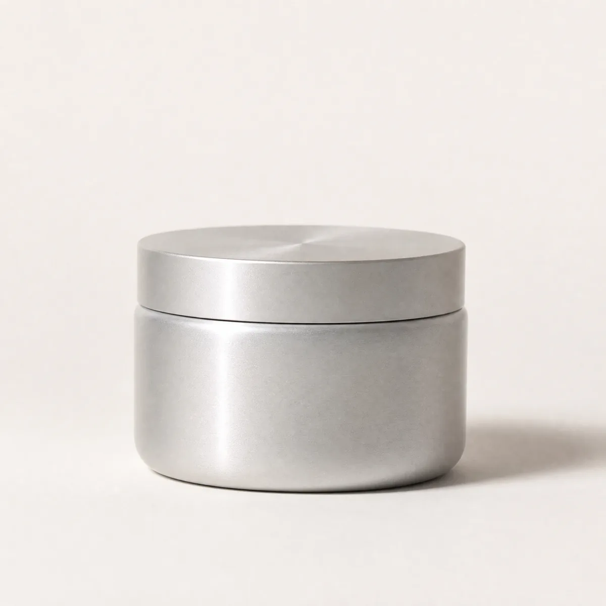 Vitamin E Pure d’Alpha Facial Moisturizing Cream, an unmarked satin aluminium jar with a matching aluminium lid